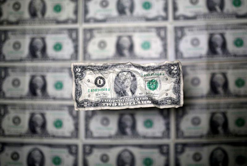 Surging dollar holds near sixweek high as virus fears return