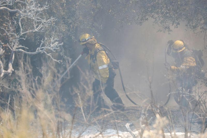 Crews make headway against massive California wildfire