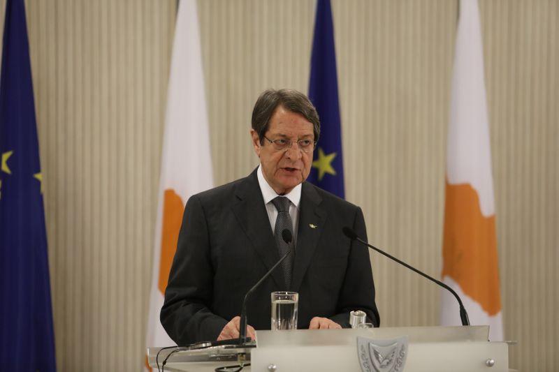 Cyprus says committed to peace talks but not at gunpoint