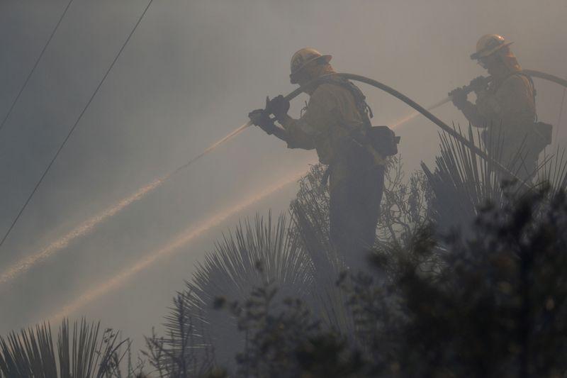 Firefighters wrest control over half of massive California wildfire