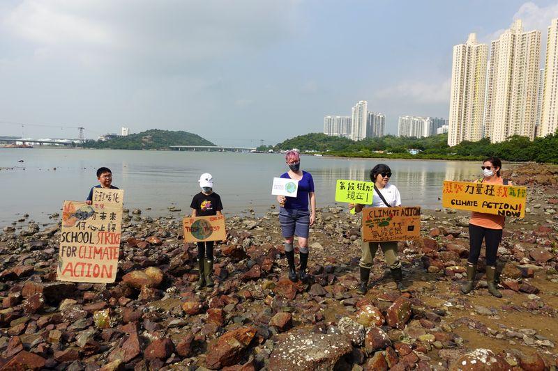 Elevenyearold climate activist leads beach cleanup in Hong Kong