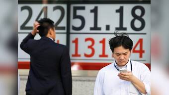 Global stocks dip amid Italy angst, but tech lifts Dow