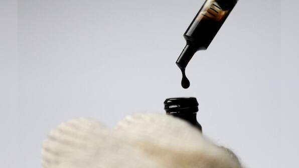 Oil eases below four-year highs; U.S. inventory rise expected