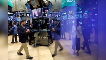 Dow hits record but Facebook weighs on Nasdaq