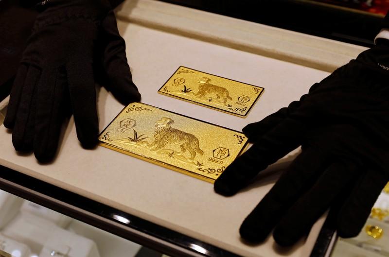 Gold firms as dollar eases set for third week of gains