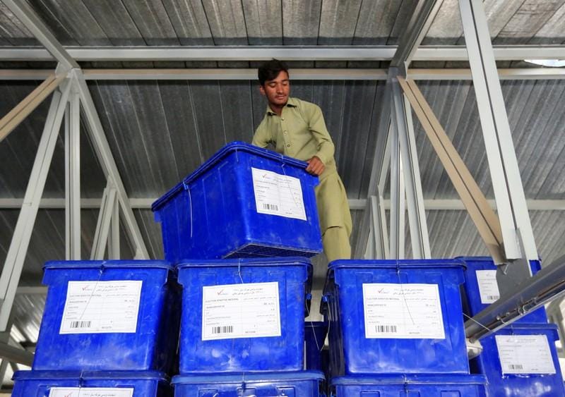 Long queues as Afghan voters defy election day attacks delays