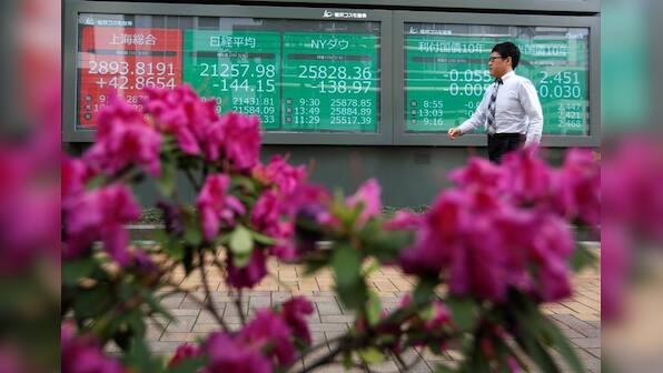 Global shares steady, investors pin hopes on U.S.-China talks