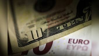 Dollar skids after weak U.S. services data