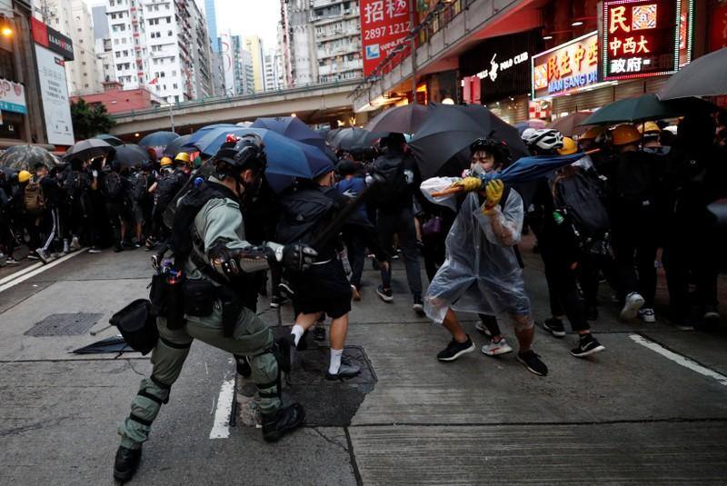 China's military warns protesters they may be arrested for targeting Hong Kong barracks with laser light China’s military warns protesters they may be arrested for targeting Hong Kong barracks with laser light