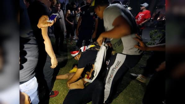 Iraqi police fire on protesters in new unrest, death toll passes 100