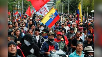 Ecuador imposes curfew after protests push government out of capital