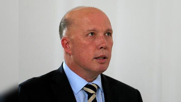 Senior Australian minister says China is behaving badly, draws rebuke