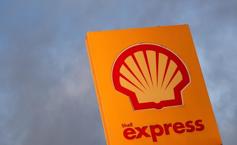 Greenpeace activists climb Shell North Sea platform saying clean up you mess