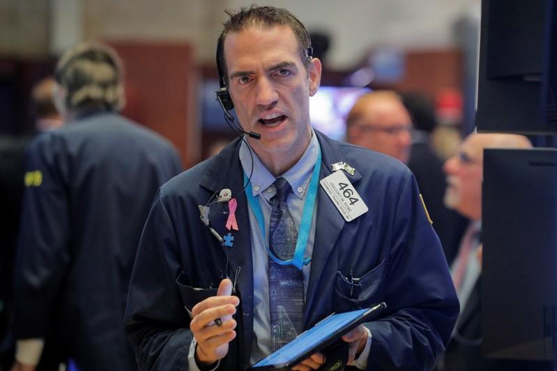 Wall Street inches lower as trade concerns linger