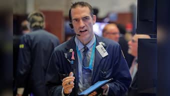 Wall Street inches lower as trade concerns linger