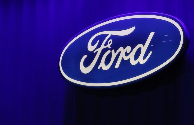 Fords thirdquarter profit falls fullyear profit outlook cut