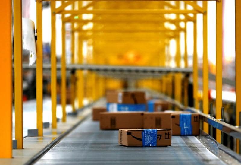 Amazons faster shipping dents profits more pain to come