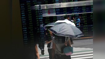 Asian shares edge up to three-month high, dollar marks time before Fed