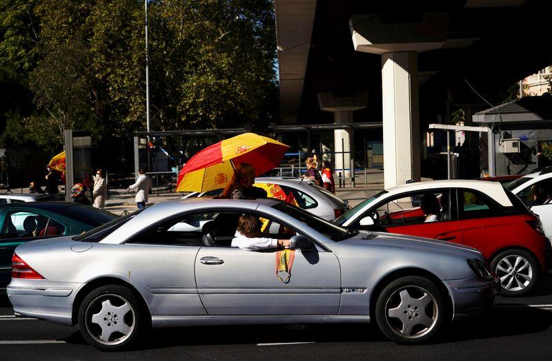 Waving Spanish flags Vox supporters protest against Madrid lockdown