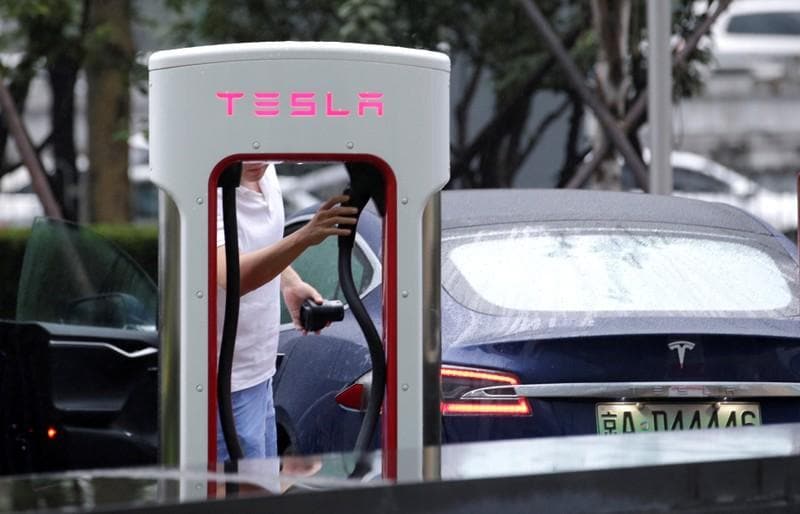 Auto group says Teslas China sales plunge companys shares slide