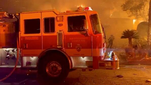 Southern California blaze threatens homes, orchards and oil fields