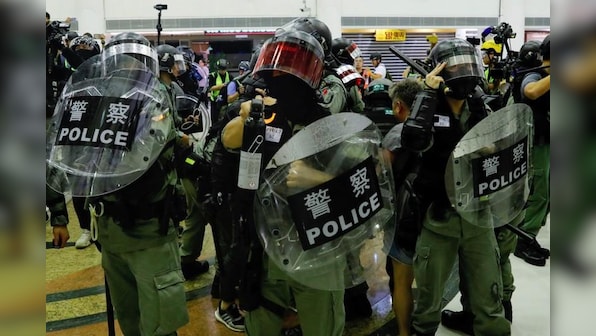 Chinese state media urge 'tougher line' in Hong Kong after Xinhua targeted