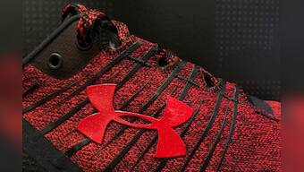 Under Armour cuts revenue forecast; federal probe weighs on shares