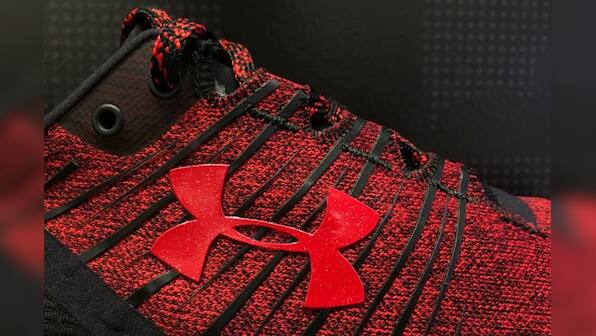 Under Armour cuts revenue forecast; federal probe weighs on shares