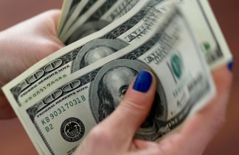 Dollar to stay mighty for another six months at least  Reuters poll