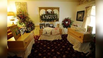 Slain in Mexico, 7-month-old twins buried in rain-swept funeral