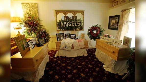 Slain in Mexico, 7-month-old twins buried in rain-swept funeral