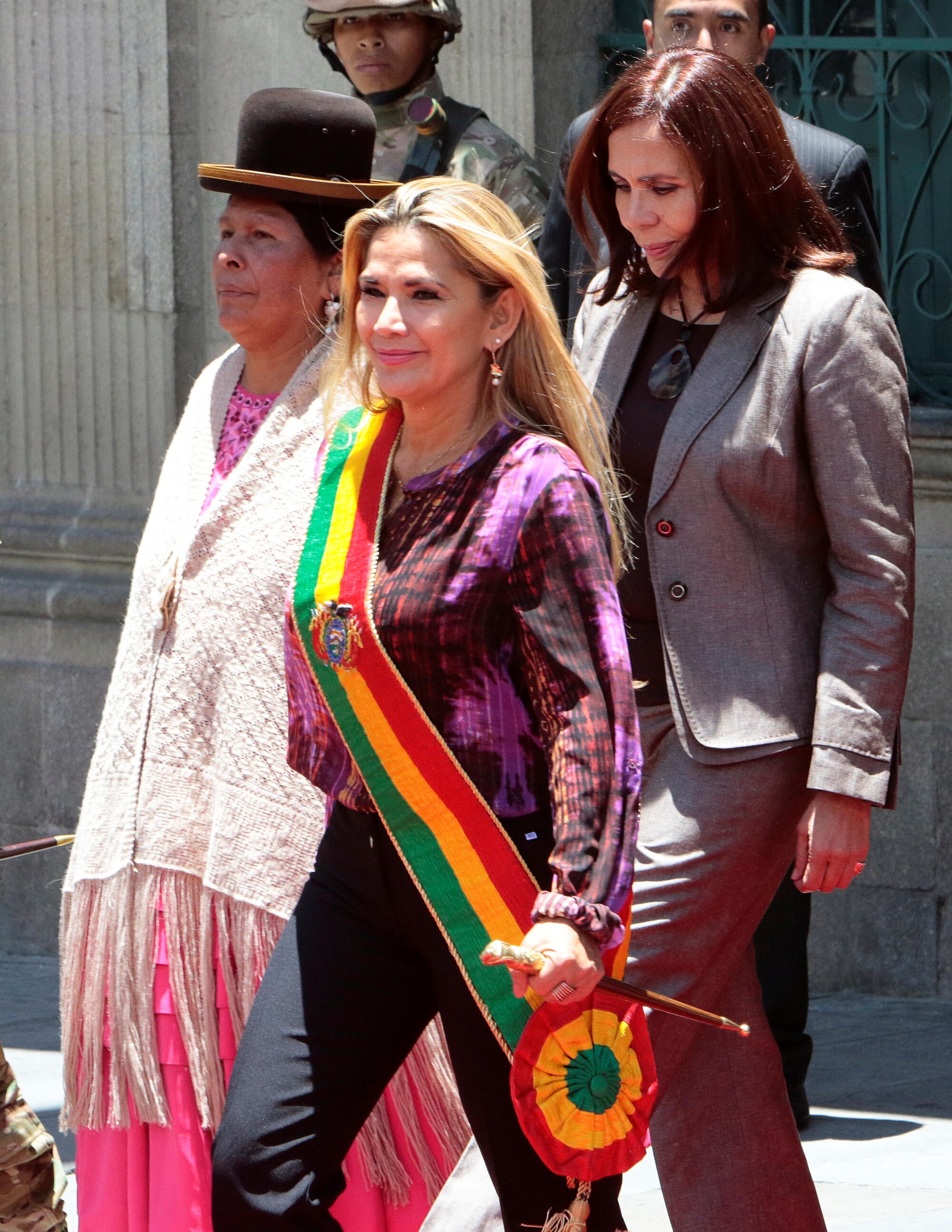 Bolivias interim president cancels trip due to credible threat as crisis roars on