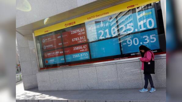 Asian shares waver, Hong Kong tensions spoil festive mood after upbeat U.S. data