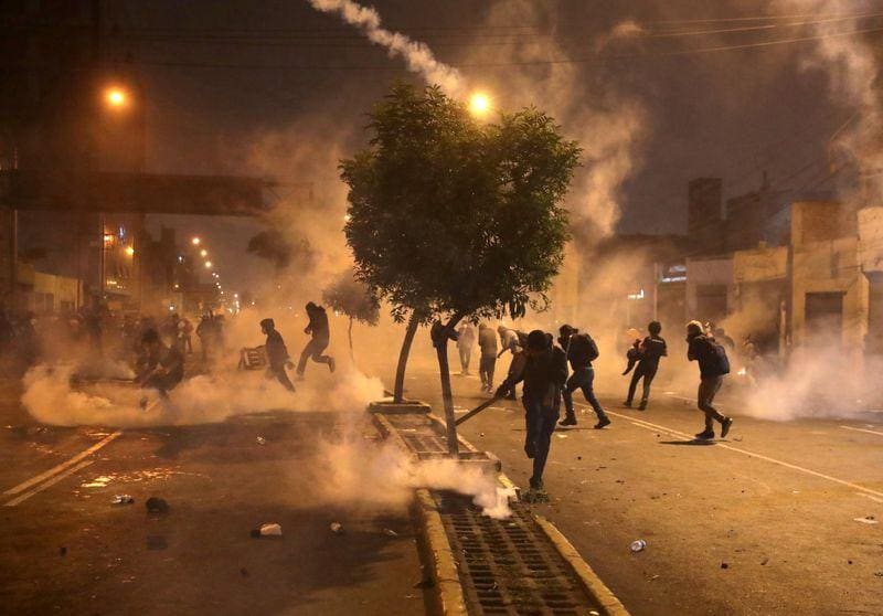 Dozens wounded in Peru as protesters and police clash amid political ...