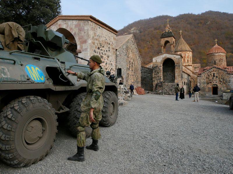 Sandbags and monks in khaki Russian troops guard Armenian monastery after ceasefire