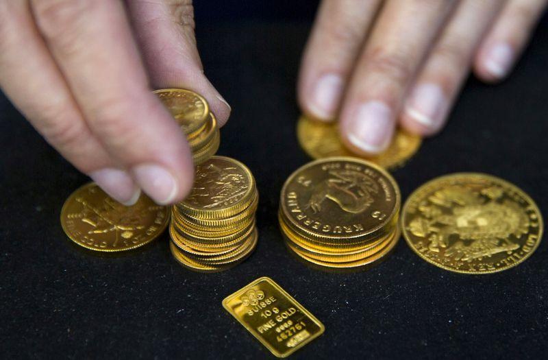 Gold dips as vaccine progress offset worries over rising cases