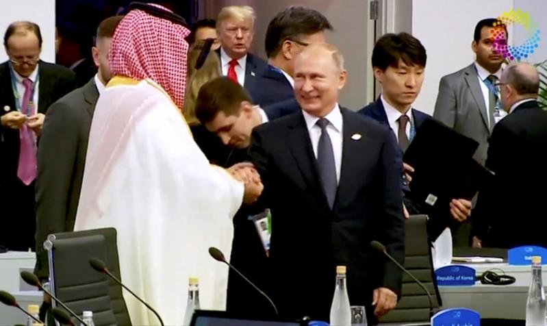 A high-five from Putin and that awkward photograph - Saudi prince's G20 summit A high-five from Putin and that awkward photograph - Saudi prince's G20 summit