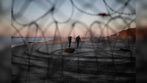 Tired of waiting for asylum, migrants from caravan breach U.S. border