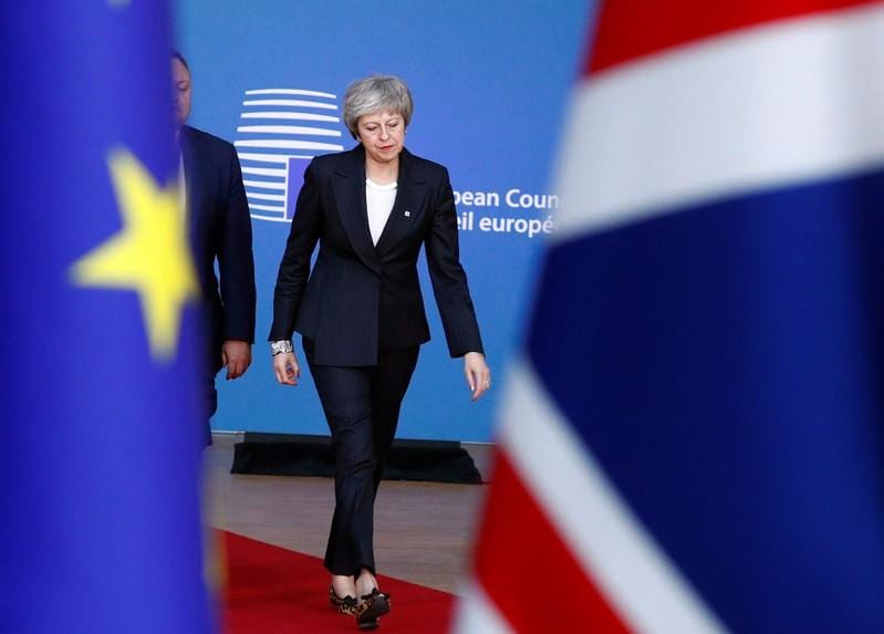 May urges EU to help get Brexit over the line