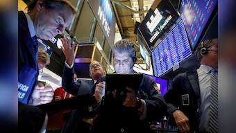 Wall Street falls on weak manufacturing data, trade woes