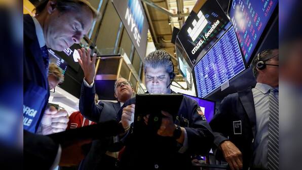 Wall Street falls on weak manufacturing data, trade woes