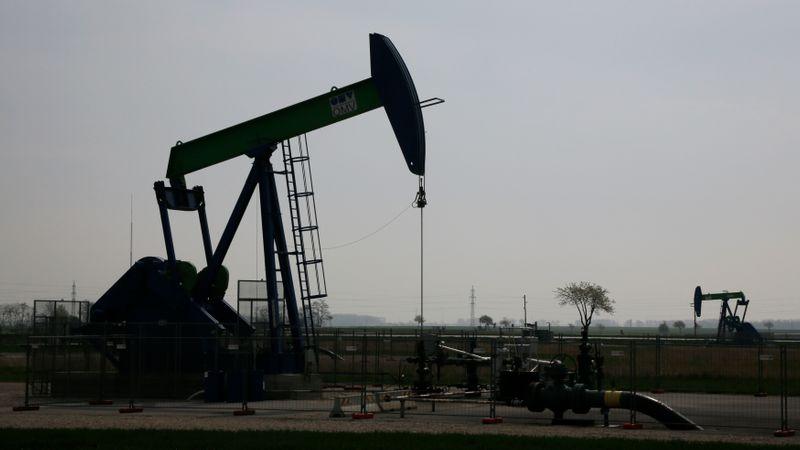 Oil drops on surprise US crude build but tariff deadline eyed