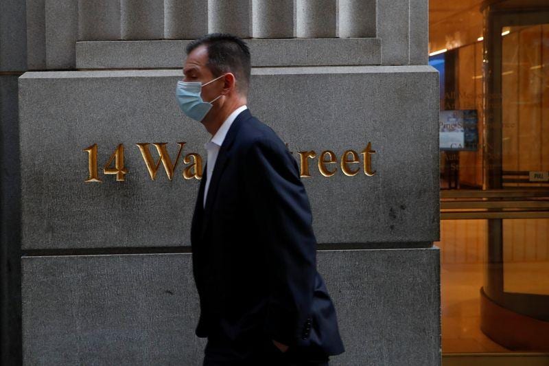 Vaccine boost helps send Wall Street to record