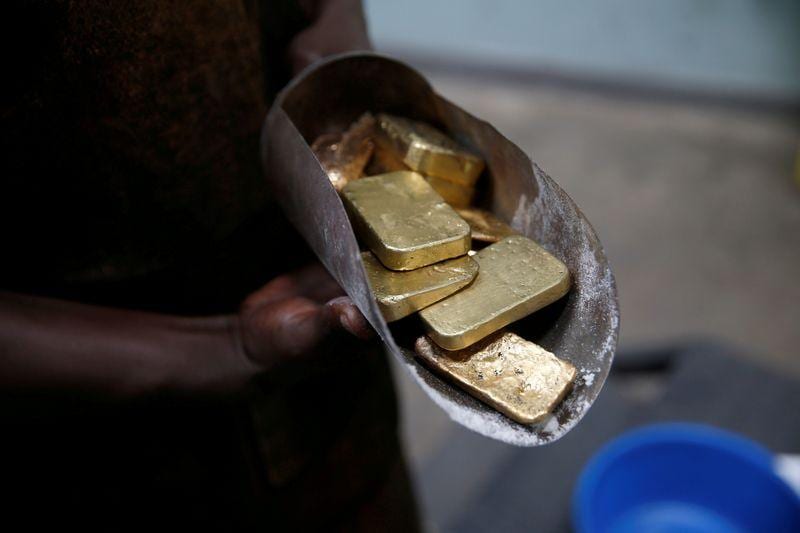 Gold climbs over 1 on US stimulus bets dipping dollar