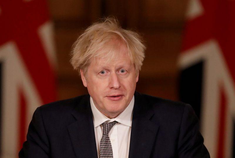 To fight new COVID strain PM Johnson reverses Christmas plans for millions